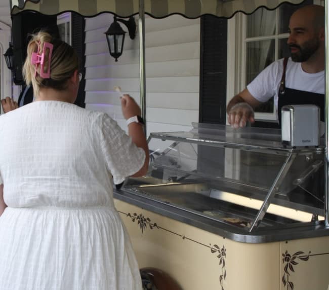 Woman tasting Carretto gelato flavour at Ballara wedding showcase, Eltham